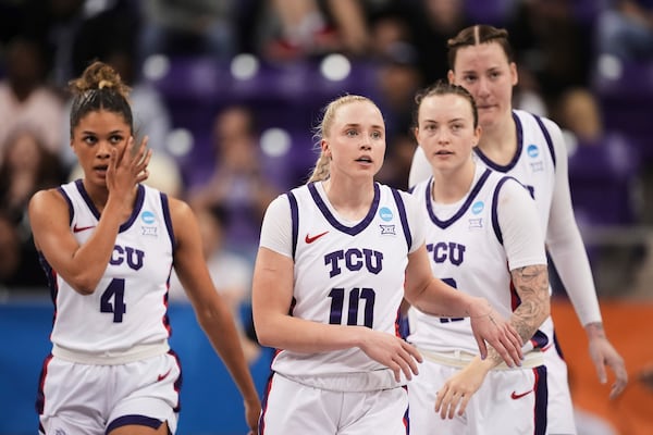 TCU's Donovyn Hunter (4), Hailey Van Lith (10), Madison Conner, second from right, and Sedona Prince, right, look to the bench in the second half against Fairleigh Dickinson in the first round of the NCAA college basketball tournament game in Fort Worth, Texas, Friday, March 21, 2025. (AP Photo/Tony Gutierrez)