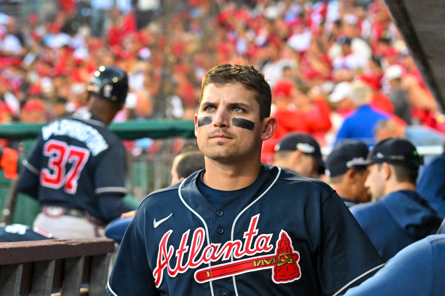 Braves third baseman Austin Riley looks on as the host Phillies celebrate their 8-3 win Saturday in Game 4 of the NLDS. The defeat eliminated the defending World Series champions from the postseason. (Hyosub Shin / Hyosub.Shin@ajc.com)