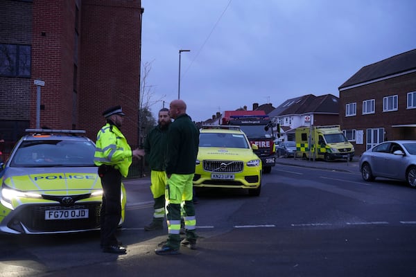 Emergency services are seen at the scene in Roseville Road, west London, Friday, March 21, 2025, near the North Hyde electrical substation, which caught fire Thursday night. (James Weech/PA via AP)