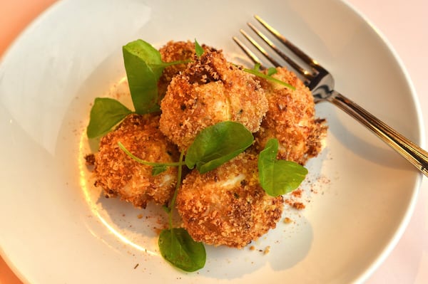 Crab Beignets can be served as a sit-down course or passed hors d’oeuvres. STYLING BY JEB ALDRICH / CONTRIBUTED BY CHRIS HUNT PHOTOGRAPHY