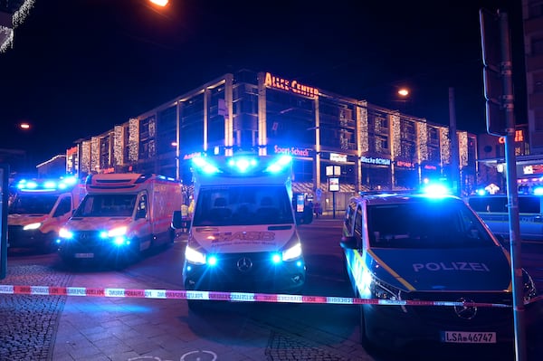 Emergency services attend an incident at the Christmas market in Magdeburg, Germany, Friday Dec. 20, 2024. (Heiko Rebsch/dpa via AP)