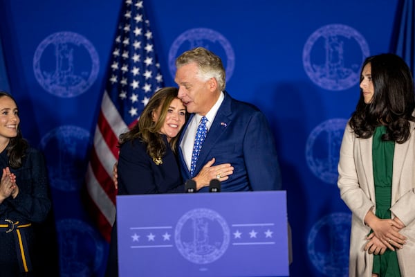 Terry McAuliffe, the Democratic nominee for governor in Virginia, embraces his wife, Dorothy, in Fairfax, Virginia. (Doug Mills/The New York Times)