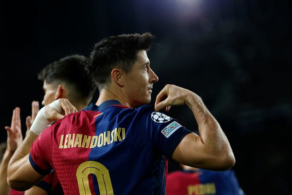 Barcelona's Robert Lewandowski celebrates after scoring his team's first goal during a Champions League phase soccer Matchday 5 between Barcelona and Brest at the Lluis Companys Olympic Stadium in Barcelona, Spain, Tuesday, Nov. 26, 2024. (AP Photo/Joan Monfort)