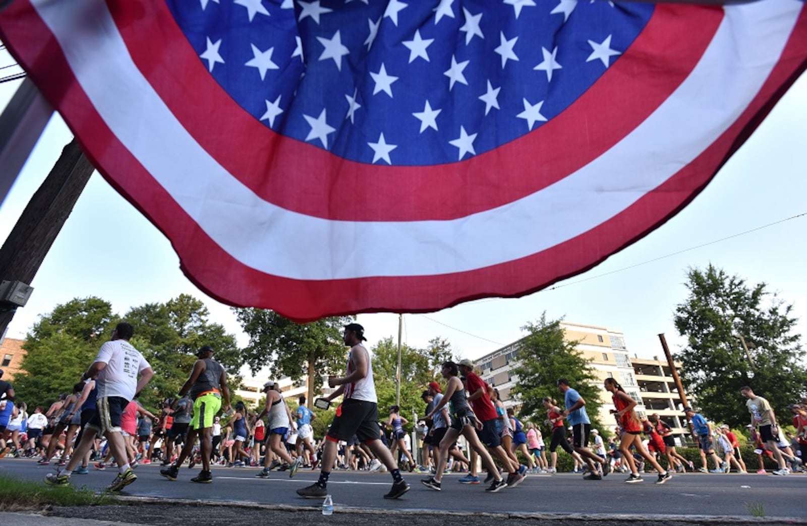 Runners approach Cardiac Hill during the AJC Peachtree Road Race on Wednesday, July 4, 2018. HYOSUB SHIN / HSHIN@AJC.COM