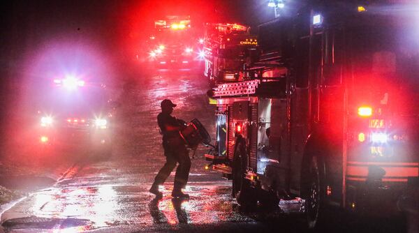 A fire caused smoke damage to a house on Candler Lake West on Friday. JOHN SPINK / JSPINK@AJC.COM