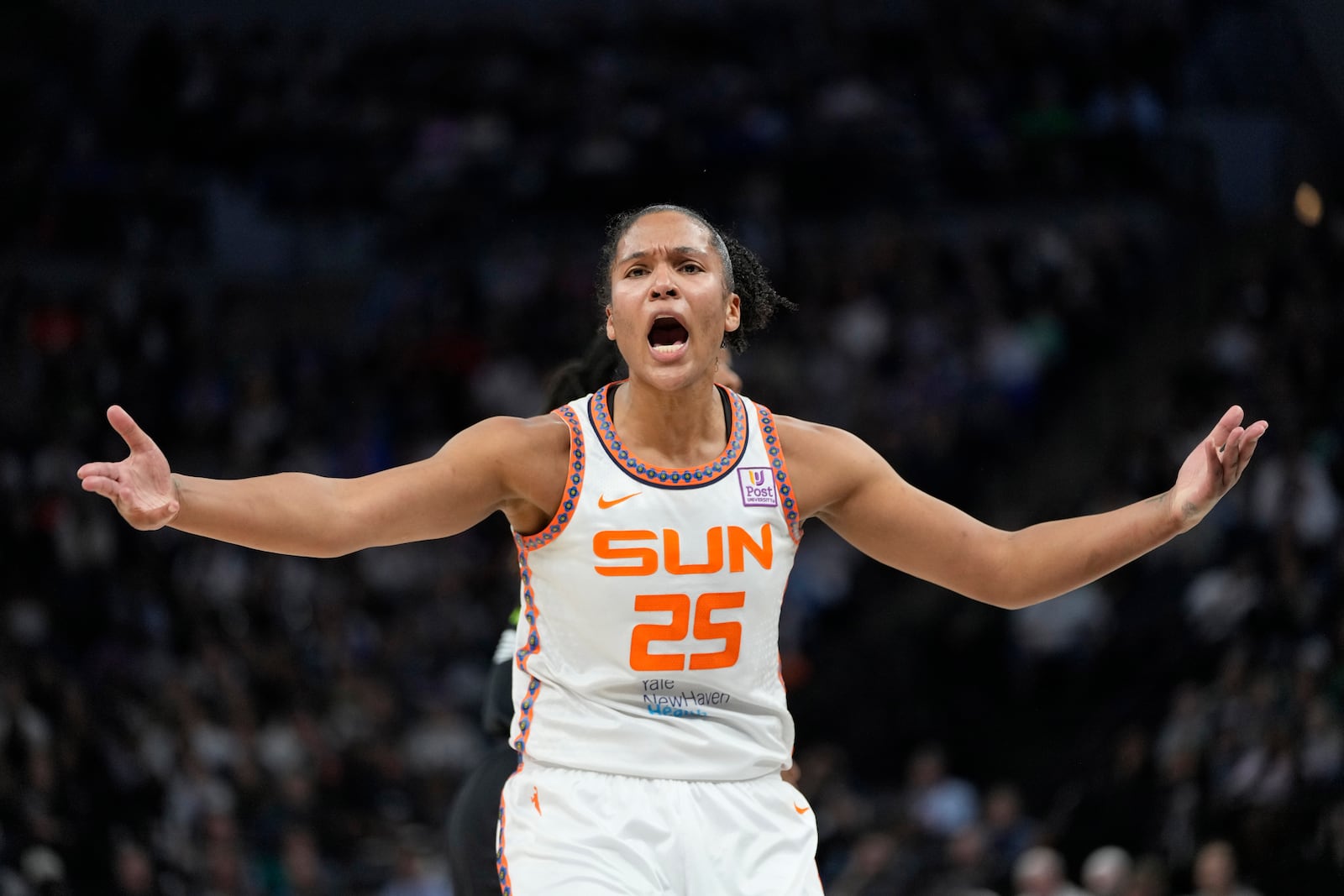 Connecticut Sun forward Alyssa Thomas (25) reacts toward a referee during the first half of Game 5 of a WNBA basketball semifinals game against the Minnesota Lynx, Tuesday, Oct. 8, 2024, in Minneapolis. (AP Photo/Abbie Parr)