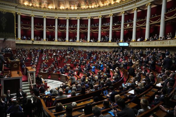 Lawmakers convene at the National Assembly during a debate and prior to a no-confidence vote that could bring down the Prime Minister and the government for the first time since 1962, Wednesday, Dec. 4, 2024 in Paris. (AP Photo/Michel Euler)