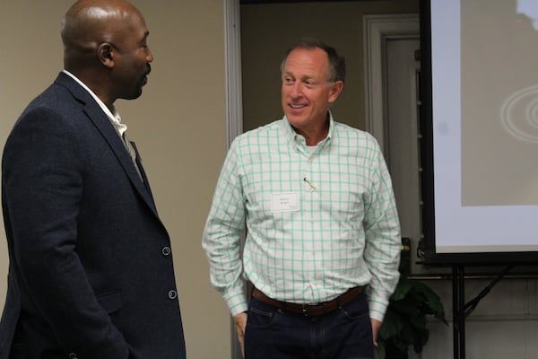 The Rev. Bryant Wright, senior pastor at Johnson Ferry Baptist Church, chats with Chris Zachery at a dinner for prospective members. Zachery and his wife have since joined the Marietta congregation. 