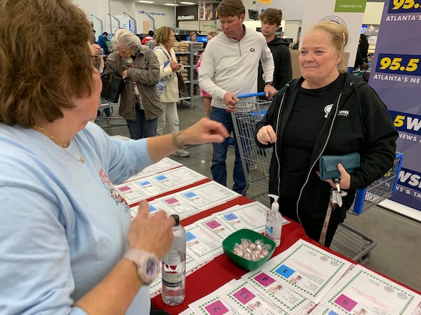 Lisa Clark (right), a regular Clark's Christmas Kids contributor, stopped by the Roswell Walmart.