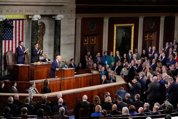 President Donald Trump speaks as Vice President JD Vance, from left, and House Speaker Mike Johnson, R-La., stand and clap as Trump addresses a joint session of Congress at the Capitol in Washington, Tuesday, March 4, 2025. (AP Photo/Alex Brandon)