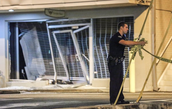 LEDE PHOTO 1 - October 5, 2015 Atlanta: Atlanta police had a busy Monday morning investigating two smash-and-grabs. At 3:45 a.m. burglars drove a vehicle through the front doors of a high-end Buckhead clothing boutique, leaving a mess of shattered glass and bent security screens (shown here). Atlanta police have not said how much merchandise was stolen by at least two suspects during the 3:45 a.m. smash-and-grab burglary at the Exclusive Game Mens Style House at Peachtree and Piedmont roads. The thieves sped away in a black Dodge Charger, police said. At a midtown print shop, dramatic surveillance video shows thieves carrying out a brazen smash-and-grab burglary at a Midtown print shop on Monday, Oct. 5, 2015 - the third break-in since July at Creative Approach on West Peachtree Street. The video, obtained by The Atlanta Journal-Constitution, clearly shows five people, four wearing hoodies and one with a T-shirt tied around his face to conceal his identity. They heave a large rock at the shops plate glass window not once or twice, but four times before shattering the window enough to gain entry. The video then shows one suspect running away with a computer. The others struggle for several seconds to pull computer monitors out the shattered window before dropping the large monitors on the sidewalk and running away empty-handed. The entire break-in lasted less than a minute. Witnesses told police the suspects who appear to be from 15- to 19-years-old, got in a dark-colored sedan with a loud muffler and sped away from the scene. Its getting really, really old, Creative Approach general manager Jeff Cela said. Something has to be done. In July, thieves broke into the print, design and marketing company and took 20 iMac computers, The Atlanta Journal-Constitution previously reported. The shop was broken into a second time on Sept. 4, according to police, but it was not clear Monday what, if anything, the thieves took in that incident. JOHN SPINK /J