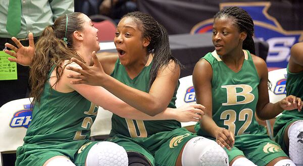 MARCH 5, 2015 MACON Buford Wolves Chandler Hall (2), Buford Wolves Camille Anderson (0) and Buford Wolves Pamela Johnson (32) celebrate following their win. Coverage of Class AAA girls championship game between Buford Wolves and Carrollton Trojans in the Georgia High School Basketball championships at the Macon Coliseum, Thursday, March 5, 2015. Buford captured the championship with a win, 35-34. KENT D. JOHNSON/KDJOHNSON@AJC.COM Buford’s girls won their fourth title in the past seven seasons.