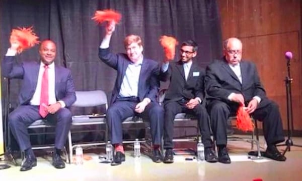 Vincent Fort, right, at a candidate's forum while running for mayor of Atlanta in 2017. He was apparently not feeling the school spirit.