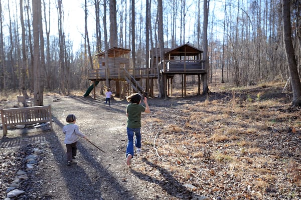 PALMETTO, GA - FEBRUARY 12: The Lollis family children play at the kid-designed treehouse at the Serenbe community in Palmetto, Georgia on Thursday, February 12, 2009. The idyllic community - which aspires to be something of a Napa for the New South, is about 25 miles south of the Atlanta airport. PHOTO CREDIT: ERIK S. LESSER FOR THE NEW YORK TIMES