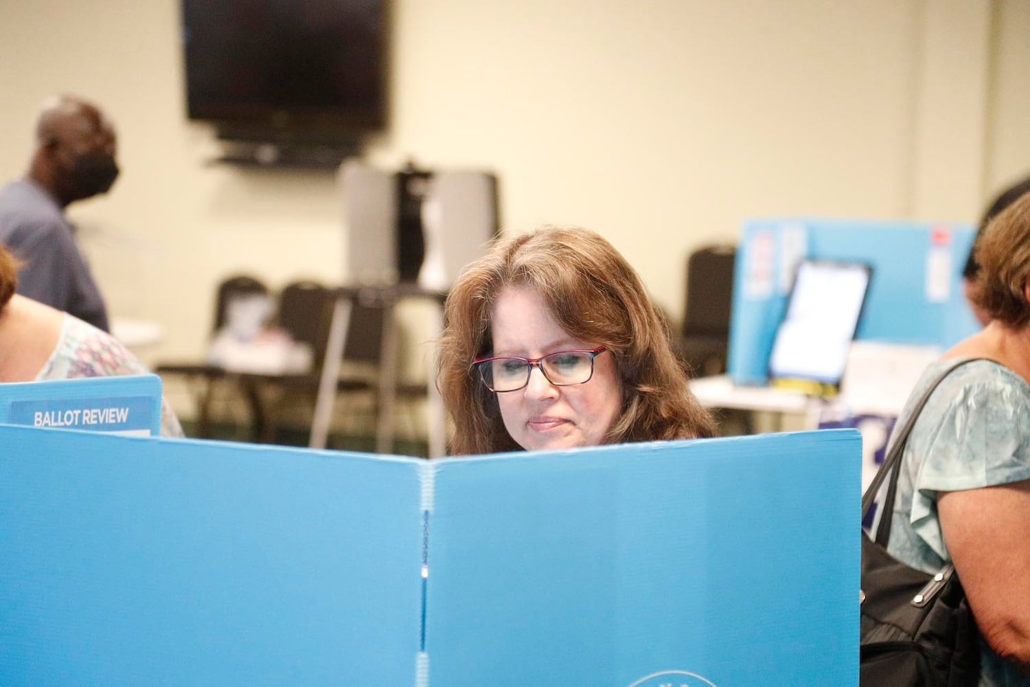 A voter casts her ballot in the Georgia primary on Tuesday May 24, 2022 at Coastal Cathedral Church in Savannah.