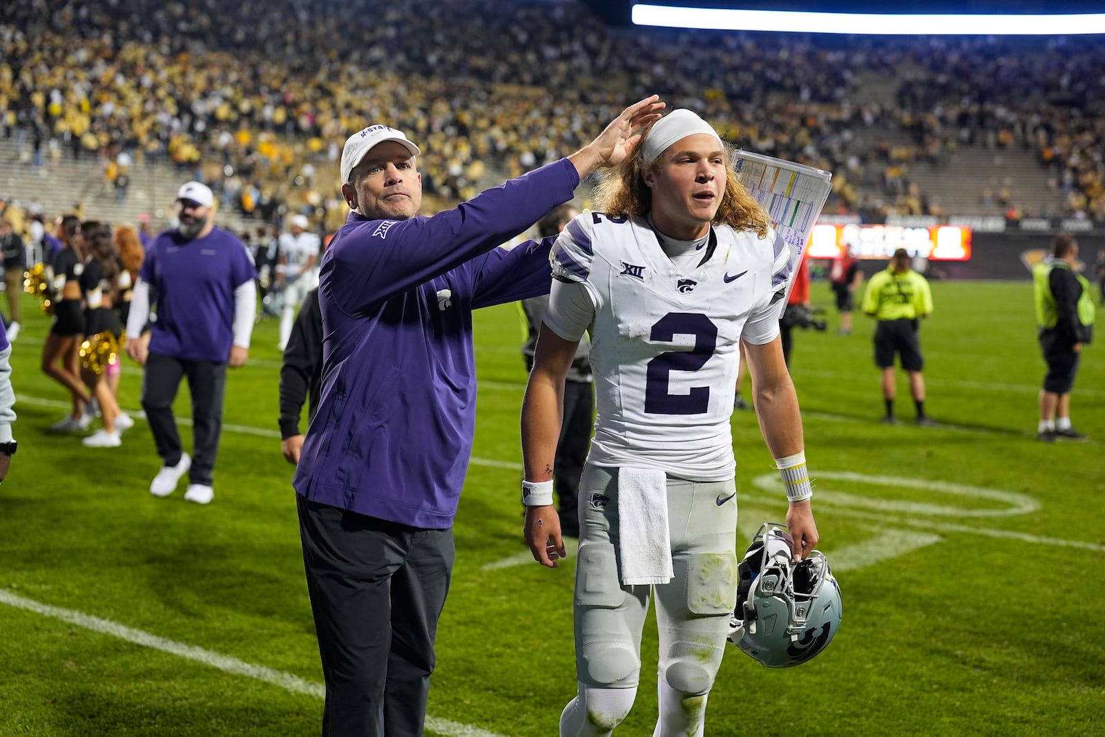 Kansas State quarterback Avery Johnson is congratulated after an NCAA college football game against Colorado Saturday, Oct. 12, 2024, in Boulder, Colo. (AP Photo/David Zalubowski)