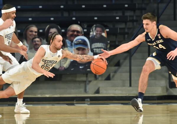 Georgia Tech guard Jose Alvarado (10) grabs a rebound against Notre Dame forward Nate Laszewski (14) in the second half Saturday, Feb. 6, 2021, at McCamish Pavilion in Atlanta. Tech won 82-80. (Hyosub Shin / Hyosub.Shin@ajc.com)