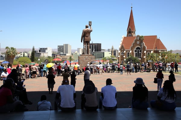 Namibians queue to cast their votes in presidential elections in Windhoek, Namibia, Wednesday, Nov. 27, 2024. (AP Photo/Dirk Heinrich)