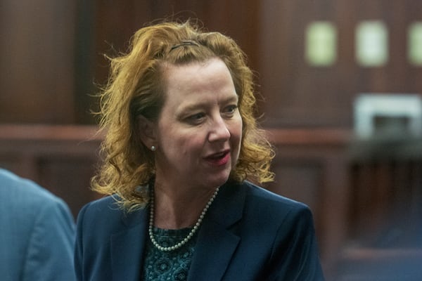 Former Brunswick Judicial Circuit District Attorney Jackie Johnson speaks to people Wednesday, Dec. 11, 2024, at the Glynn County Courthouse in Brunswick, Georgia, prior to a pretrial motions hearing in her violation of oath office case. (Michael Hall/Pool Photo via AP)