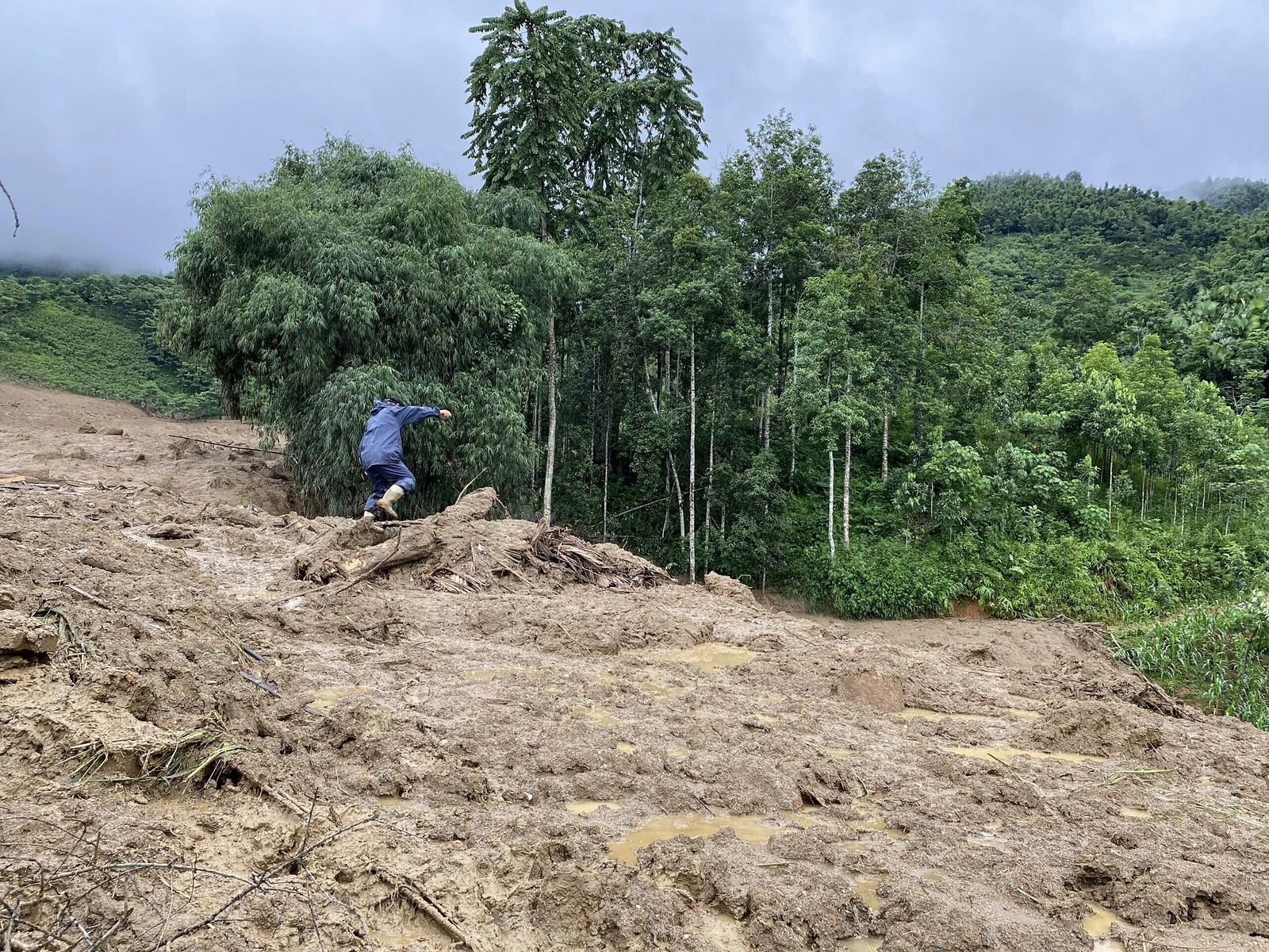 Mud and debris bury houses in Lang Nu hamlet in Lao Cai province, Vietnam Tuesday, Sep. 10, 2024. (Pham Hong Ninh/VNA via AP)