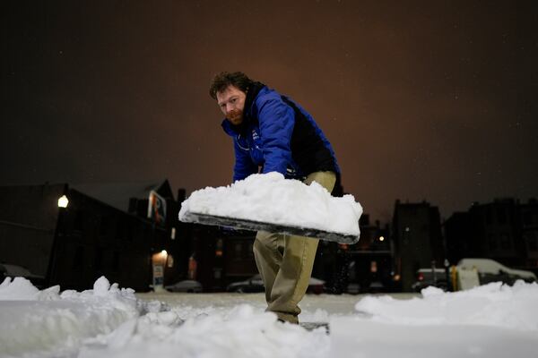 FILE - Tom Fleischman shovels snow in Cincinnati before dawn on Monday, Jan. 6, 2025. (AP Photo/Carolyn Kaster, File)