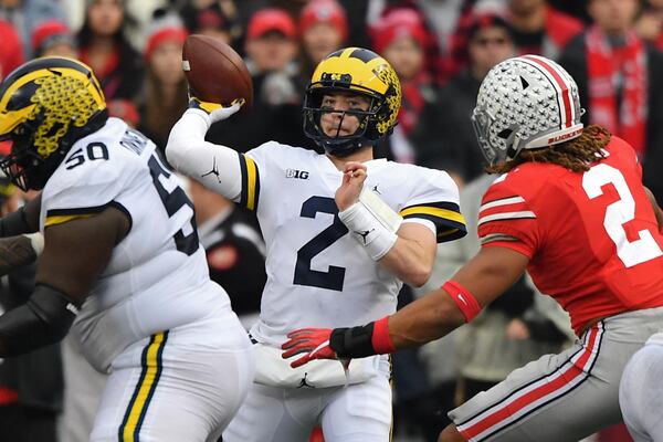 Michigan quarterback Shea Patterson  throws a pass in the third quarter against the Ohio State Buckeyes Nov. 24, 2018, at Ohio Stadium in Columbus, Ohio. 