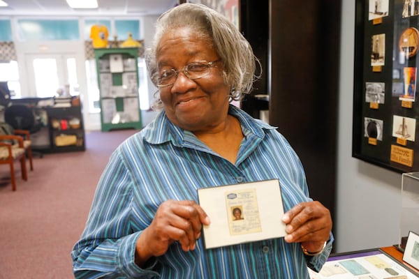 Emma Lou Gibbs holds her employee badge from when she worked for Thiokol. Emma Lou usually worked on the trip flare line, but was moved to the 81mm line before the explosion on February 3, 1971.