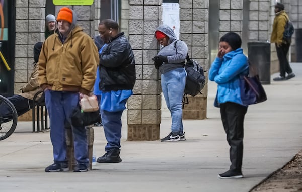 Commuters brave the cold on Friday morning at the Marietta Transfer Center at 800 South Marietta Parkway.