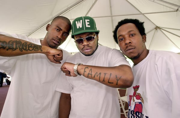 Rico Wade (from left), rapper 'Backbone' and Backbone's manager Bernard Parks rat a party Sunday, April 22, 2001, at Wade's Atlanta home to wrap up a weekend of Universal Records showcasing it's Southern acts. (Kimberly Smith/staff)