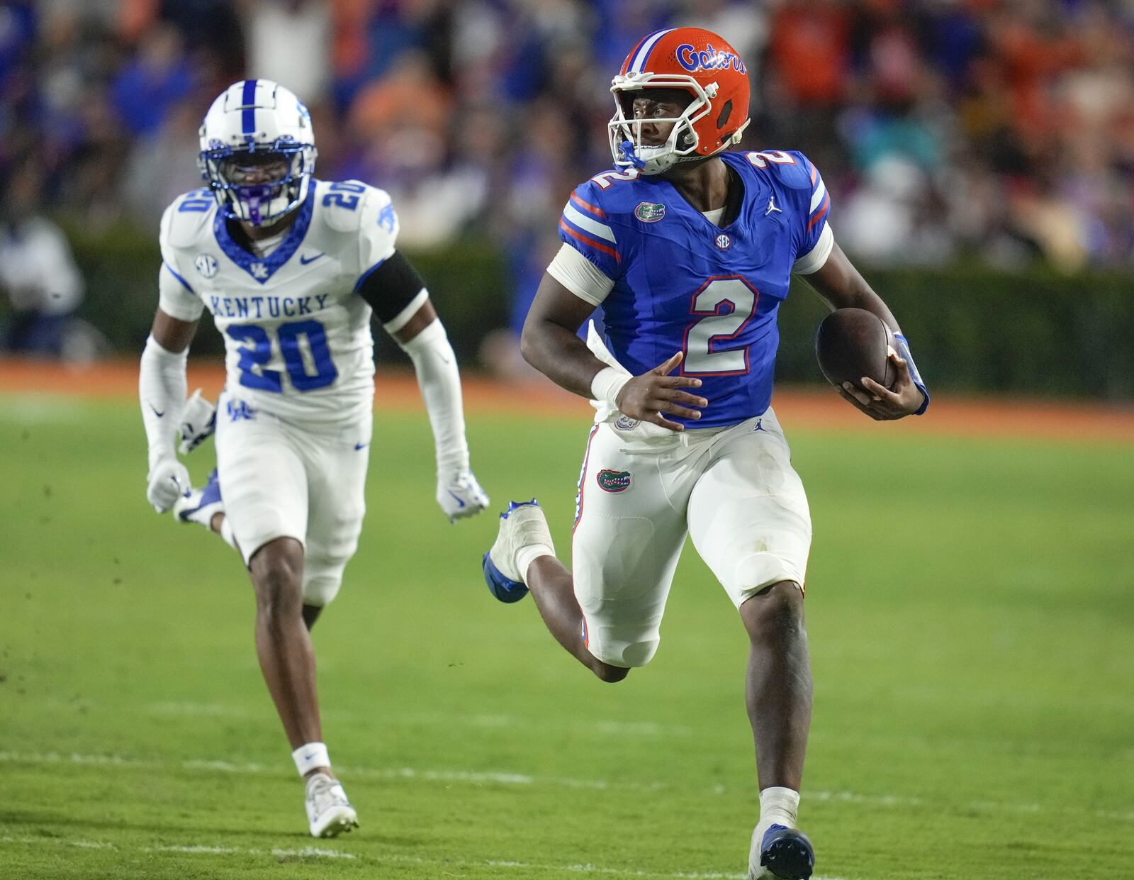 Florida Gators quarterback DJ Lagway runs away from a Kentucky defender during last week's victory over the Wildcats.