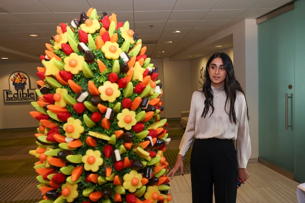 Edible CEO Somia Farid Silber discusses the main display in the front of their Atlanta office on Friday, Oct. 4, 2024. (Jason Getz/AJC)

