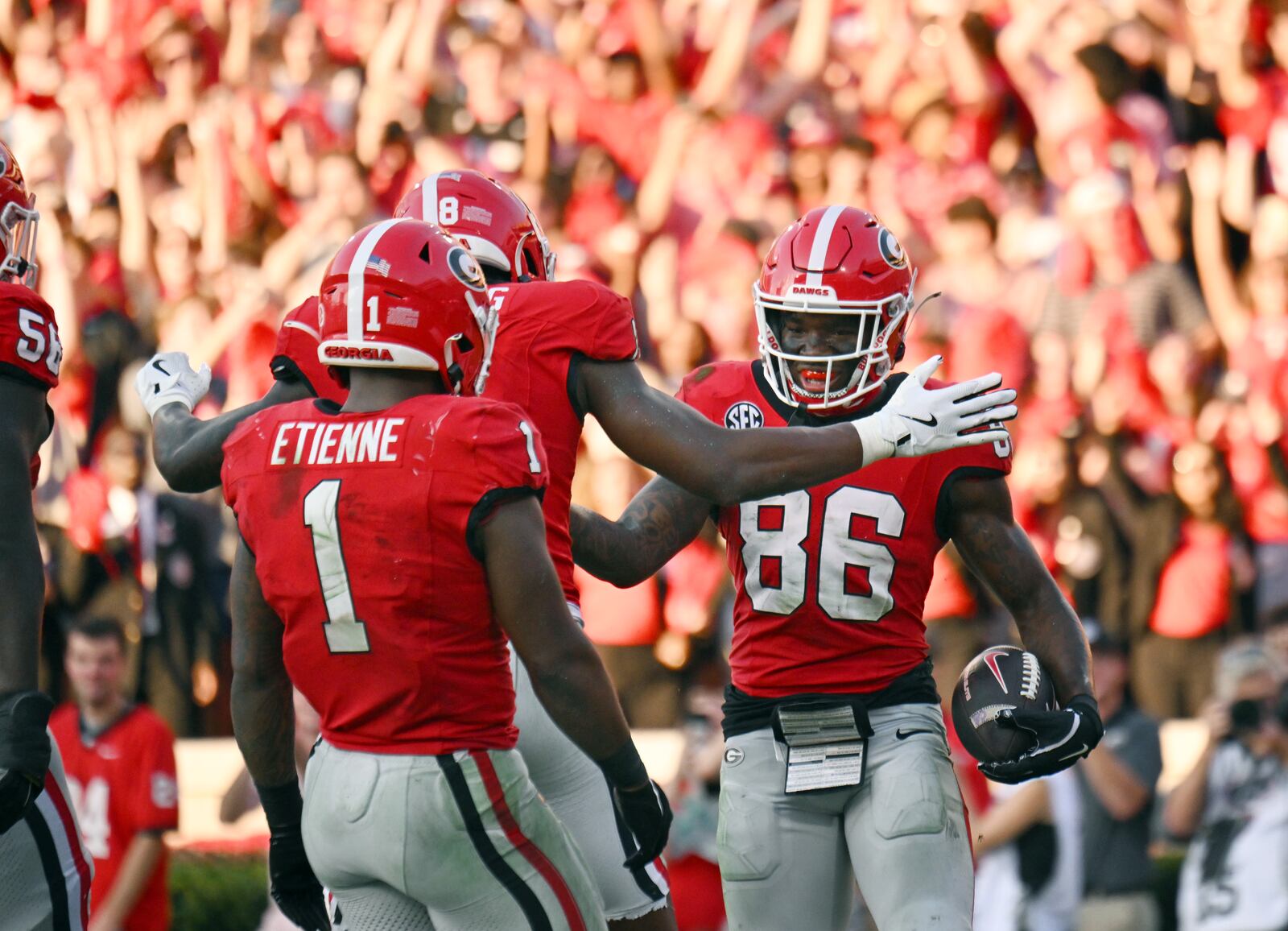 Georgia wide receiver Dillon Bell (86) with teammates after scoring a touchdown during the second half in an NCAA football game at Sanford Stadium, Saturday, October 5, 2024, in Athens. Georgia won 31-13 over Auburn. (Hyosub Shin / AJC)