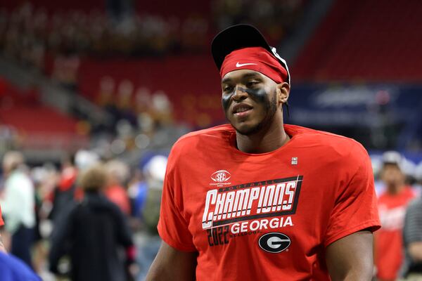 Georgia offensive lineman Devin Willock wears a Georgia SEC 2022 Champions shirt after Georgia defeated LSU 50-30 in the SEC Championship game on Dec. 3 at Mercedes-Benz Stadium. (Jason Getz / Jason.Getz@ajc.com)
