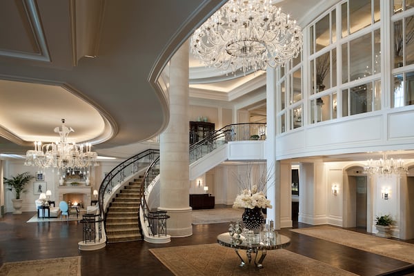 A chic lobby with sparkling chandeliers and a dramatic staircase sets the tone for a luxurious stay at the St. Regis Atlanta. CONTRIBUTED BY: St. Regis Atlanta