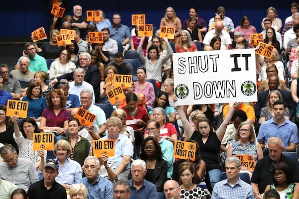 August 19, 2019 Marietta: Many area residents hold signs in opposition as Cobb officials and environmental regulators hold a town hall and community forum in the wake of reports that Cobb and Fulton have high levels of carcinogenic gas on Monday, August 19, 2019, in Marietta. A user and emitter of the gas, Sterigenics, which sterilizes medical equipment, operates in the area.  Curtis Compton/ccompton@ajc.com