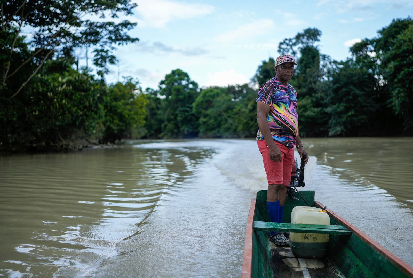 Bernardino Mosquera, a river guardian, maneuvers his boat on the Quito River, near Paimado, Colombia, Monday, Sept. 23, 2024. (AP Photo/Ivan Valencia)