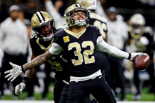 New Orleans Saints safety Tyrann Mathieu (32) celebrates his interception off Atlanta Falcons quarterback Kirk Cousins during the second half of an NFL football game, Sunday, Nov. 10, 2024, in New Orleans. (AP Photo/Butch Dill)