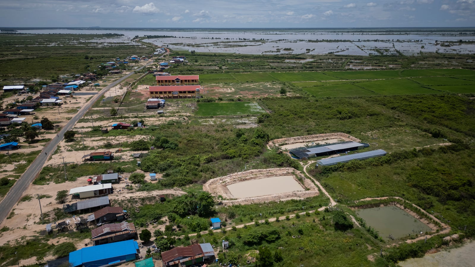 An aerial view of Em Phat's eel farm on the edges of Tonle Sap lake, north of Phnom Penh, Cambodia, Wednesday, July 31, 2024. (AP Photo/Anton L. Delgado)