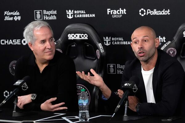 Inter Miami's new head coach Javier Mascherano, right, speaks as the team's managing owner and CEO Jorge Mas, left, looks on during an MLS soccer news conference, Tuesday, Dec. 3, 2024, in Fort Lauderdale, Fla. (AP Photo/Wilfredo Lee)