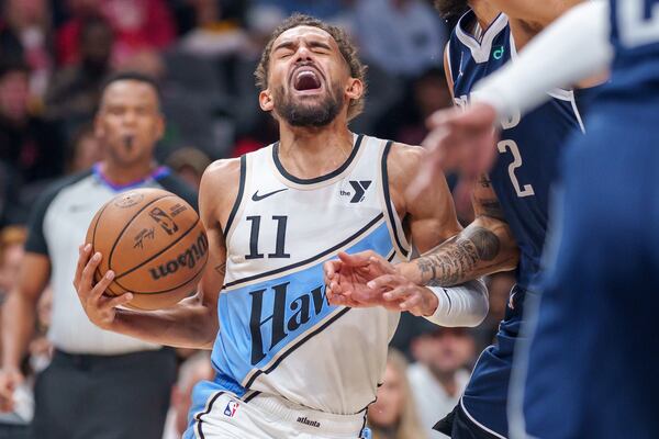 Hawks guard Trae Young reacts during a layup attempt in Monday's game against the Mavericks.