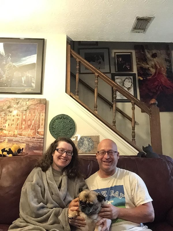 Susan and Steve Lang, along with Neo, their “cranky” dog, enjoy some relaxation at their home-based staycation. 
(Courtesy of Steve Lang)