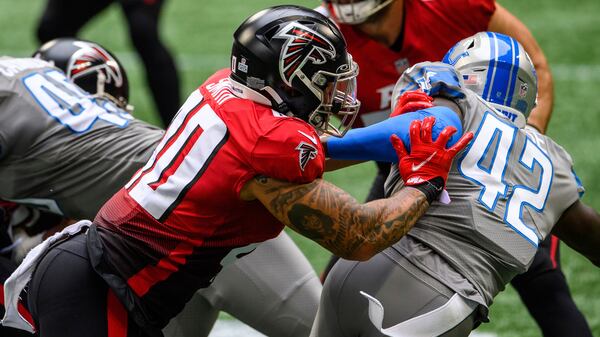 Falcons fullback Keith Smith (40) blocks Detroit Lions safety Jayron Kearse (42) during the first half Sunday, Oct. 25, 2020, at Mercedes-Benz Stadium in Atlanta. The Lions won 23-22. (Danny Karnik/AP)