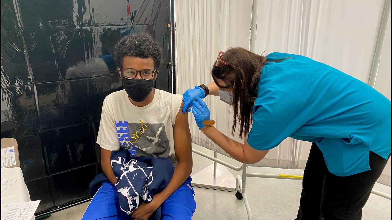 Georgia Tech nurse Melanie Thomas administers a COVID-19 vaccine shot to student Grayson Prince at its Exhibition Hall on July 20, 2021. The school has been doing vaccinations on Tuesdays this summer for students and employees. ERIC STIRGUS/ESTIRGUS@AJC.COM.