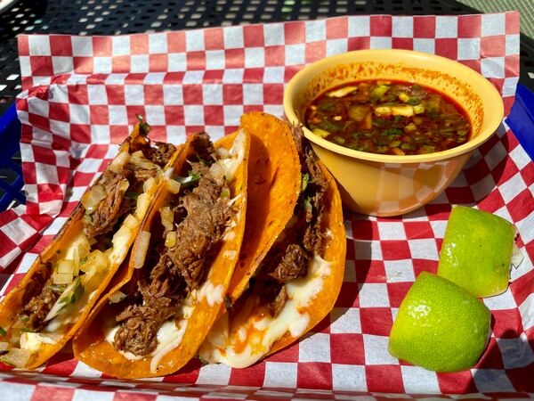 Birria tacos and consomme for dipping at Frida's Taqueria in Lilburn.
(Angela Hansberger for The Atlanta Journal-Constitution)