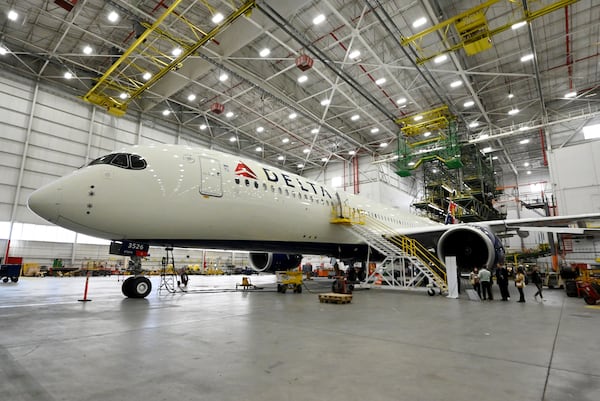 Exterior of an Airbus A350 with a new cabin design at Delta TechOps, Friday, January 24, 2025, in Atlanta. Delta unveiled a new cabin design on Tuesday, featuring improved lighting, seating and refreshed branding elements. (Hyosub Shin / AJC)