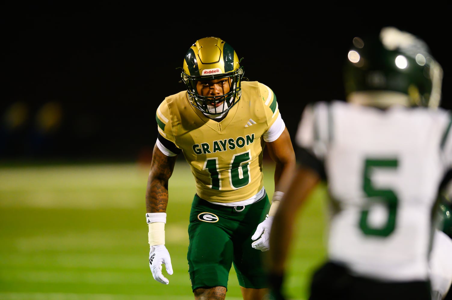 Grayson junior linebacker Tyler Atkinson stands ready on the line of scrimmage. (Jamie Spaar for the Atlanta Journal Constitution)