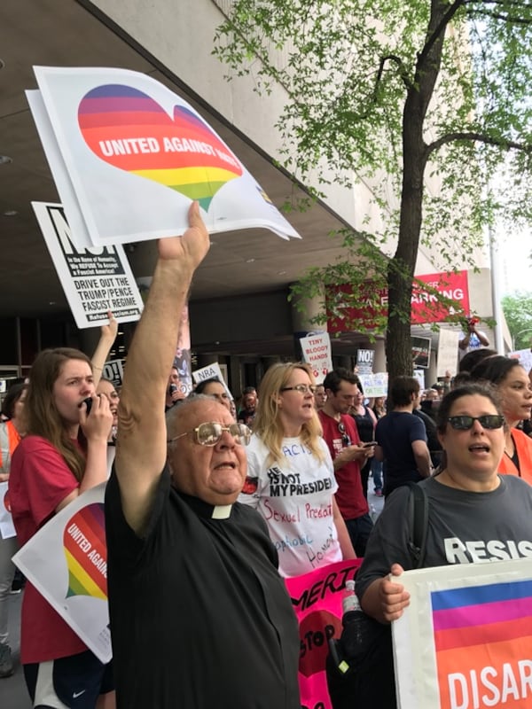 Protesters shouted "Not my president," as President Donald Trump arrived to attend a fundraiser for Karen Handel in downtown Atlanta.