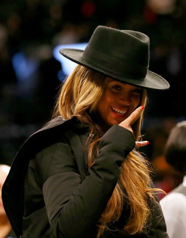 NEW YORK, NY - JANUARY 12: Beyonce walks off the court after the game between the Brooklyn Nets and the Houston Rockets at the Barclays Center on January 12, 2015 in the Brooklyn borough of New York City.The Houston Rockets defeated the Brooklyn Nets 113-99. NOTE TO USER: User expressly acknowledges and agrees that, by downloading and/or using this photograph, user is consenting to the terms and conditions of the Getty Images License Agreement. (Photo by Elsa/Getty Images) Queen Bey is a front-runner for Album of the Year.