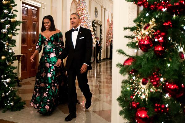 President Barack Obama and first lady Michelle Obama arrive for a reception to honor recipients of the 2016 Kennedy Center Honors in the East Room of the White House in Washington, Sunday, Dec. 4, 2016. (AP Photo/Manuel Balce Ceneta)