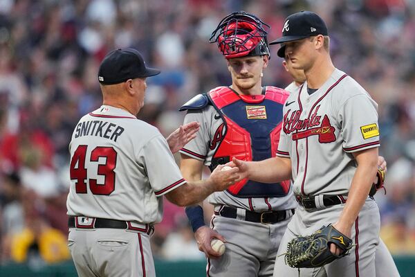 Braves manager Brian Snitker takes starting pitcher Michael Soroka out of the baseball game against the Cleveland Guardians during the fifth inning, Wednesday, July 5, 2023, in Cleveland. (AP Photo/Sue Ogrocki)